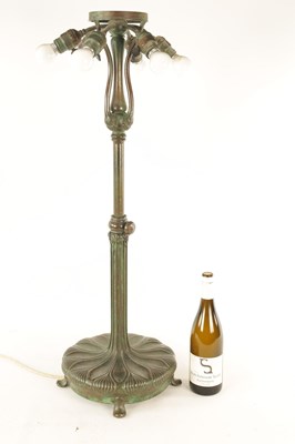 Lot 725 - TIFFANY & CO. NEW YORK. A LARGE STYLISH ART NOUVEAU GREEN PATINATED BRONZE TELESCOPIC AND STAINED GLASS TABLE LAMP