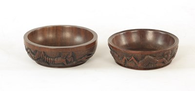 Lot 1149 - A PAIR OF AFRICAN LIGNUM VITAE RELIEF CARVED CIRCULAR BOWLS