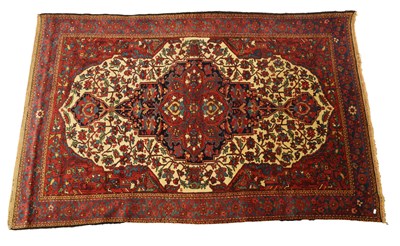 Lot 720 - A VINTAGE PERSIAN SAROUK RUG