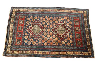 Lot 713 - A VINTAGE ORIENTAL RUG