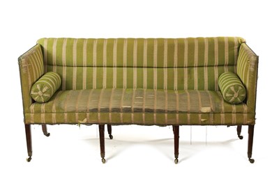 Lot 1188 - A GEORGE III UPHOLSTERED AND MAHOGANY FRAMED THREE SEATER COUNTRY HOUSE SETTEE