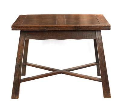 Lot 932 - AN OAK ARTS AND CRAFTS OAK DRAW-LEAF DINING TABLE