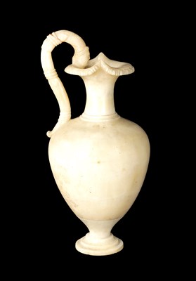 Lot 472 - AN EARLY CARVED ALABASTER URN