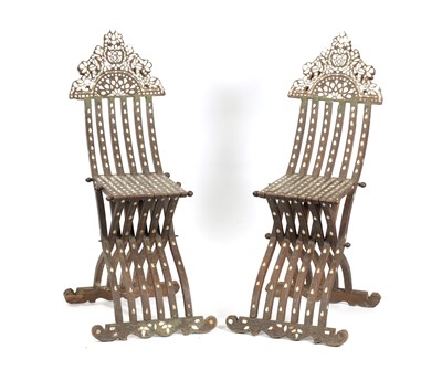 Lot 67 - A PAIR OF 19TH CENTURY ISLAMIC OTTOMAN HARDWOOD AND MOTHER OF PEARL INLAID FOLDING CHAIRS