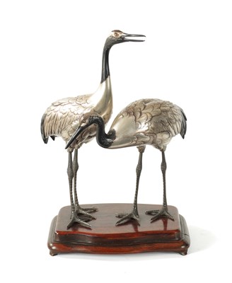 Lot 70 - A FINE JAPANESE MEIJI PERIOD SILVERED BRONZE OKIMONO OF TWO CRANES