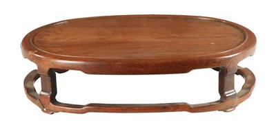 Lot 134 - A 19TH CENTURY CHINESE HARDWOOD OVAL SHAPED JARDINIERE STAND