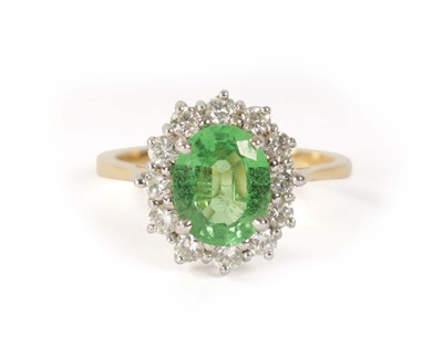 Lot 190 - AN 18CT.750 HALLMARKED YELLOW GOLD CLUSTER SET PERIDOT AND DIAMOND DRESS RING