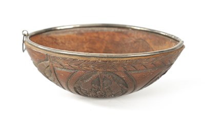 Lot 122 - AN 18TH CENTURY EASTERN SILVER MOUNTED HALF COCONUT BUGBEAR CUP