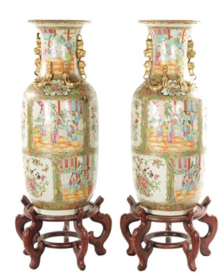 Lot 91 - A LARGE PAIR OF 19TH CENTURY CANTON FAMILLE ROSE VASES ON STANDS