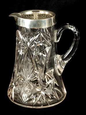 Lot 309 - AN EARLY 20TH CENTURY CUT GLASS AND SILVER MOUNTED LEMONADE  JUG