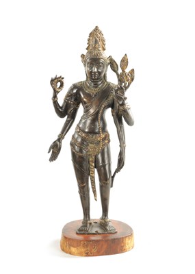 Lot 156 - AN EARLY BRONZE AND GILT BRONZE INDIAN FIGURE OF TARA