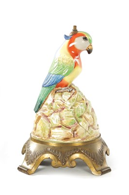 Lot 43 - AN EARLY 20TH CENTURY DOULTON PORCELAIN AND CAST BRASS TABLE LAMP FORMED AS A PARROT