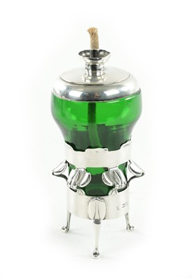 Lot 684 - KATE HARRIS, AN ARTS AND CRAFTS SILVER AND GLASS TABLE LIGHTER