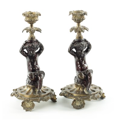 Lot 55 - A PAIR OF MID 20TH CENTURY CAST BRASS CHERUB CANDLESTICKS