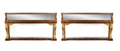 Lot 1412 - A MASSIVE PAIR OF REGENCY COUNTRY HOUSE FINE PAIR OF ROSEWOOD AND CARVED GILTWOOD CONSOLE TABLES IN THE MANNER OF GILLOWS