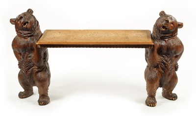 Lot 1068 - A GOOD 19TH CENTURY BLACK FOREST LINDEN WOOD CARVED BEAR HALL BENCH