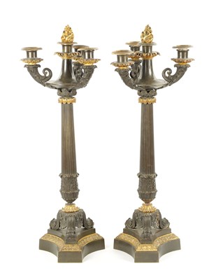 Lot 1023 - A PAIR OF REGENCY BRONZE AND ORMOLU THREE BRANCH CANDELABRA