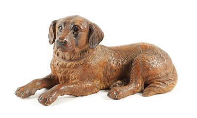 Lot 1090 - A 19TH CENTURY BLACK FOREST CARVED LINDEN WOOD DOG SCULPTURE