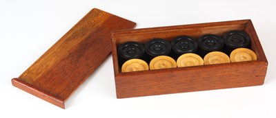 Lot 485 - A SET OF BOXWOOD AND EBONY DRAFTS PIECES in a...