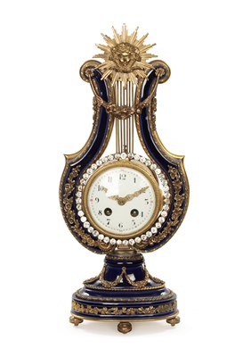 Lot 1318 - A LATE 19TH CENTURY FRENCH PORCELAIN AND ORMOLU MOUNTED LYRE-SHAPED MANTEL CLOCK