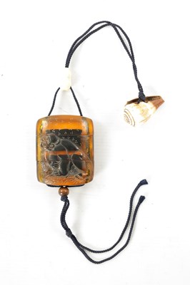 Lot 606 - A 19TH CENTURY JAPANESE CARVED AMBER INRO