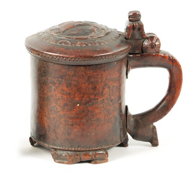 Lot 1079 - A FINE 18TH CENTURY CARVED CEREMONIAL LION PEG TANKARD