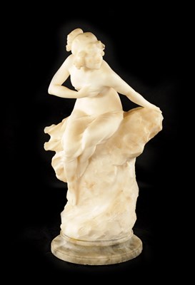 Lot 1037 - AN ART NOUVEAU CARVED ALABASTER FIGURE OF A SEMI-NUDE LADY