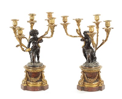 Lot 923 - A GOOD PAIR OF ORMOLU AND BRONZE CHERUB FIVE BRANCH CANDELABRA