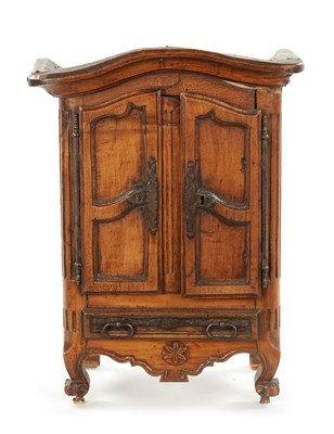 Lot 1061 - AN 18TH CENTURY FRUITWOOD MINIATURE ARMOIRE