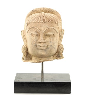 Lot 52 - A CARVED STONE HEAD OF AN INDIAN BUDDHA