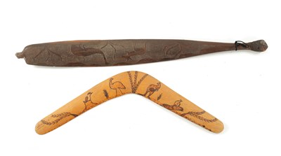 Lot 298 - AN ABORIGINAL MULGA WOOD SPEAR THROWER  WITH CARVED ANIMALS AND AN OLD BOOMERANG.