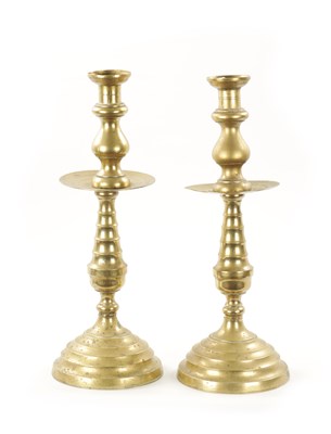 Lot 202 - A LARGE PAIR OF 18TH CENTURY BRASS CANDLESTICKS