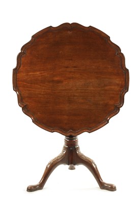 Lot 304 - AN 18TH CENTURY FIGURED MAHOGANY PIE CRUST TRIPOD TABLE ON MANX FEET