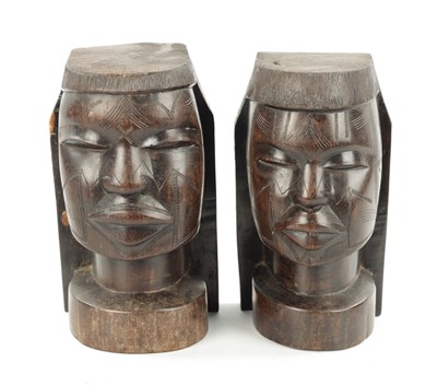 Lot 82 - A PAIR OF CARVED HARDWOOD NATIVE BOOKENDS