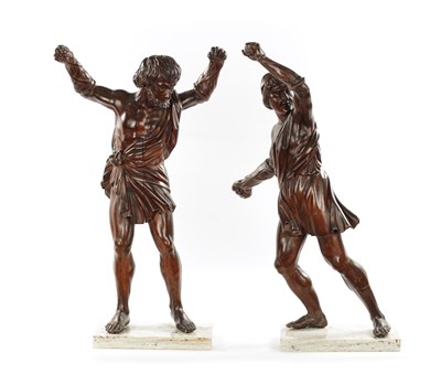 Lot 337 - A PAIR OF GRAND TOUR CARVED WALNUT GLADIATORS AFTER THE BORGHESE BRONZE ROMAN FIGURES