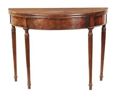 Lot 143 - A LATE 18TH CENTURY DEMI LUNE CARD TABLE ON FLUTED LEGS IN THE MANNER OF GILLOWS