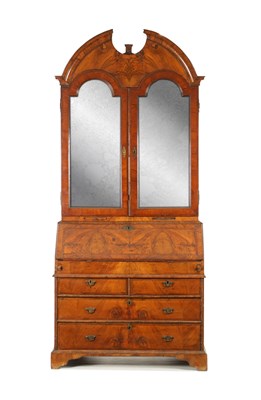 Lot 219 - AN EARLY 18TH CENTURY FIGURED WALNUT AND OAK BREAK ARCHED TOP BUREAU BOOKCASE