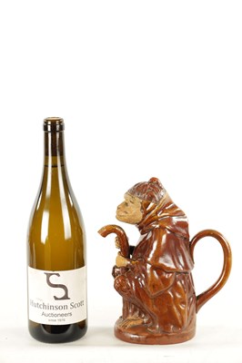 Lot 476 - A 19TH CENTURY POTTERY MONKEY PITCHER JUG