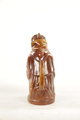 Lot 476 - A 19TH CENTURY POTTERY MONKEY PITCHER JUG
