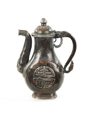 Lot 617 - A 19TH CENTURY MINIATURE EASTERN MIXED METAL EWER