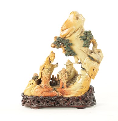 Lot 511 - A CHINESE QING DYNASTY SOAPSTONE FIGURAL GROUP CARVING