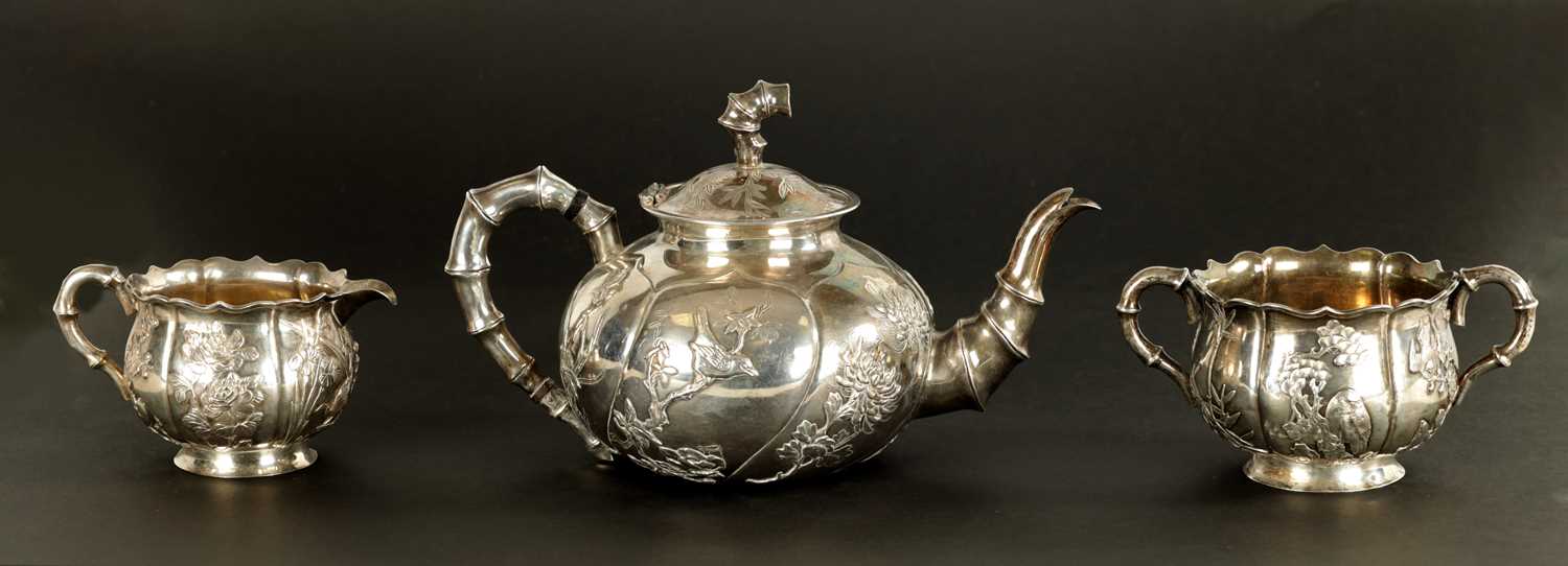 Lot 543 - A LATE 19TH CENTURY CHINESE SILVER THREE-PIECE TEA SET