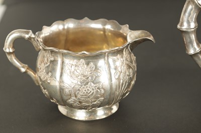 Lot 543 - A LATE 19TH CENTURY CHINESE SILVER THREE-PIECE TEA SET