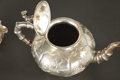 Lot 543 - A LATE 19TH CENTURY CHINESE SILVER THREE-PIECE TEA SET