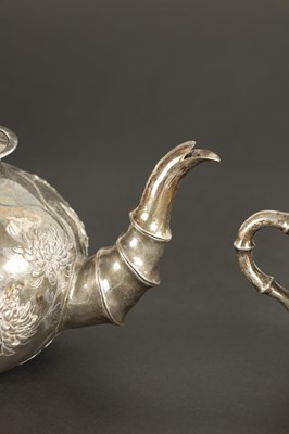 Lot 543 - A LATE 19TH CENTURY CHINESE SILVER THREE-PIECE TEA SET