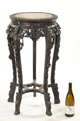 Lot 529 - A 19TH CENTURY CHINESE CARVED HARDWOOD JARDINIERE STAND