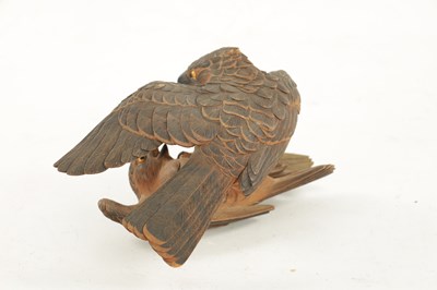 Lot 532 - A JAPANESE MEIJI PERIOD CARVED WOOD OKIMONO OF TWO QUARRELLING HAWKS