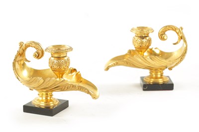 Lot 1008 - A PAIR OF 19TH CENTURY GILT BRASS REGENCY STYLE CANDLESTICKS