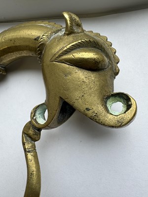 Lot 816 - A 19TH CENTURY INDIAN RAJPUT BRONZE SWORD HILT