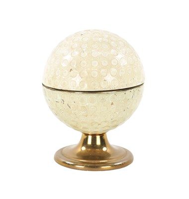 Lot 971 - ‘GOLFING INTEREST’ A DESK LIGHTER FORMED AS A GOLF BALL ON STAND